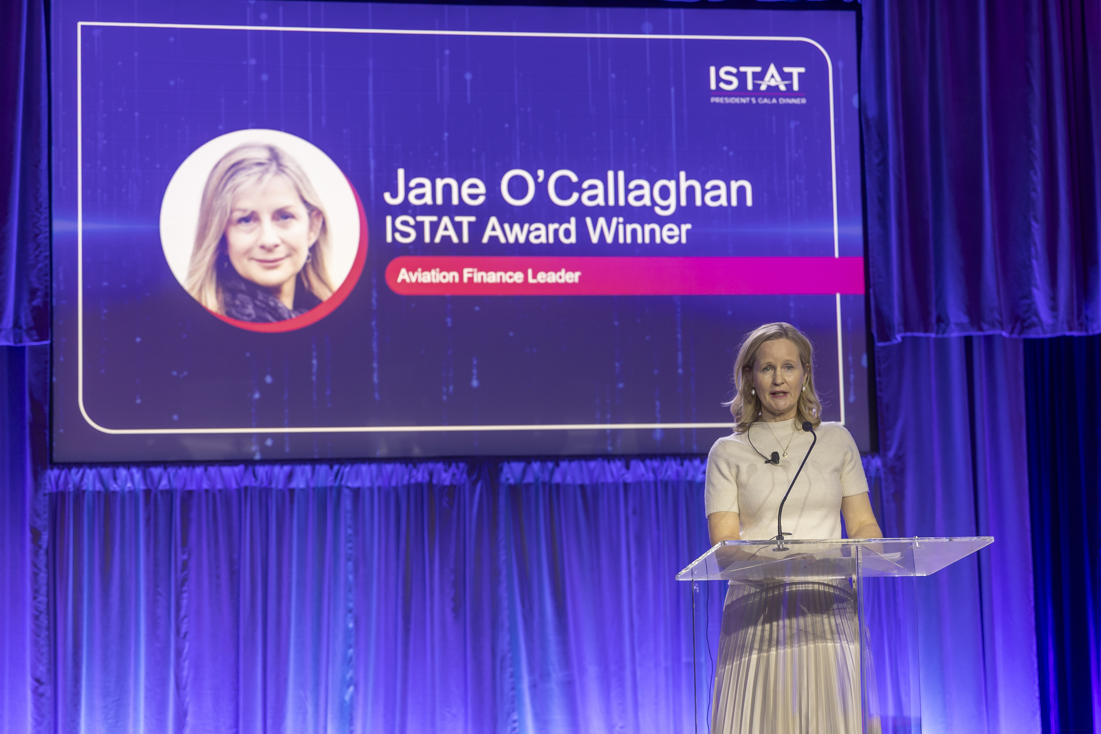 ISTAT Americas 2025 delegate accepting the ISTAT Award on behalf of Jane O'Callaghan.